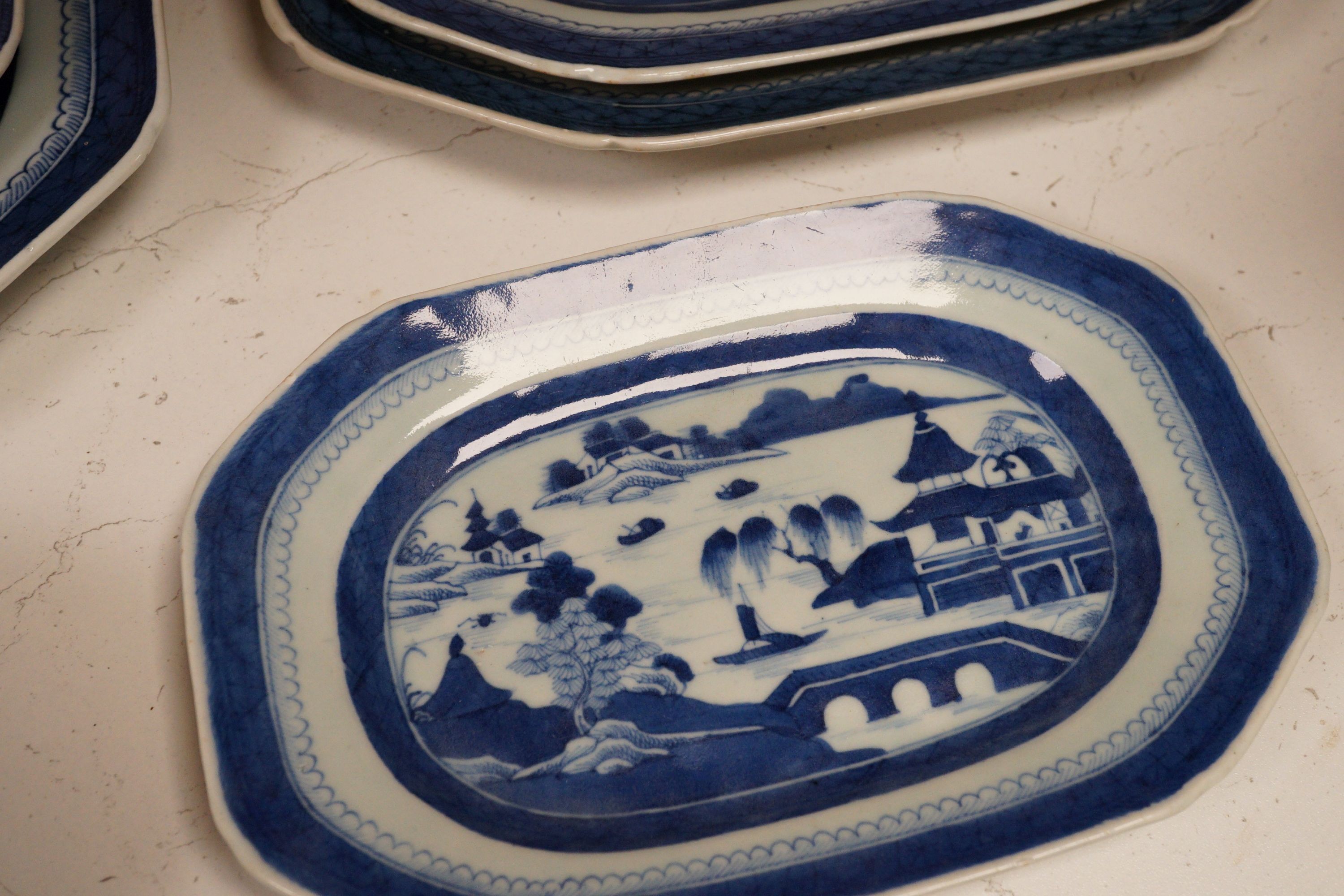 A group of Chinese blue and white porcelain, early 19th century, to include five graduated trays, and two tureens